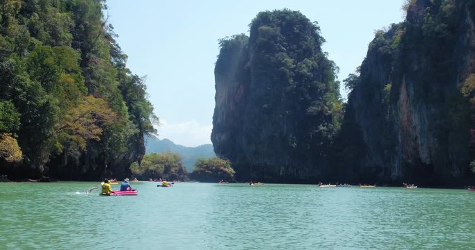 PHUKET, THAILAND, MARCH 2017:  Padling in small boats, through caves and alleys in Phi Phi Islands