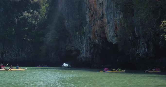 PHUKET, THAILAND, MARCH 2017:  Padling in small boats, through caves and alleys in Phi Phi Islands