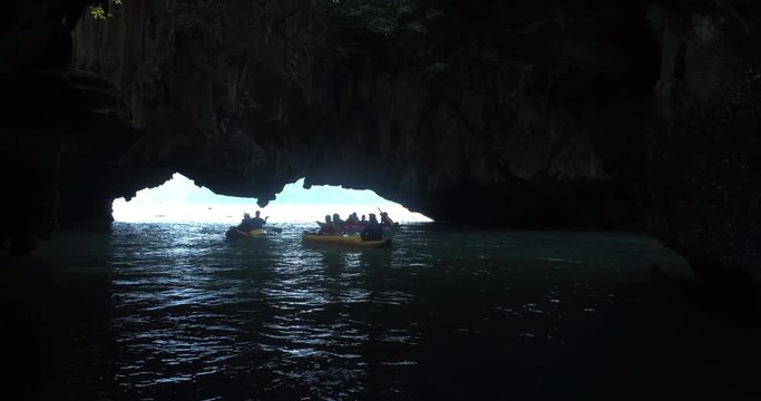 PHUKET, THAILAND, MARCH 2017:  Padling in small boats, through caves and alleys in Phi Phi Islands