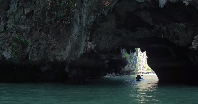 PHUKET, THAILAND, MARCH 2017:  Padling in small boats, through caves and alleys in Phi Phi Islands