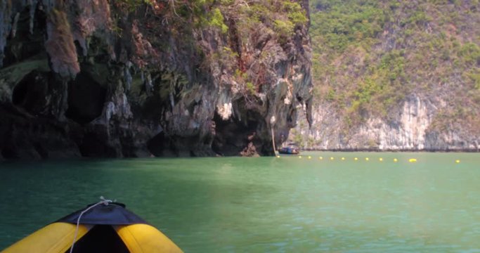 PHUKET, THAILAND, MARCH 2017:  Padling in small boats, through caves and alleys in Phi Phi Islands