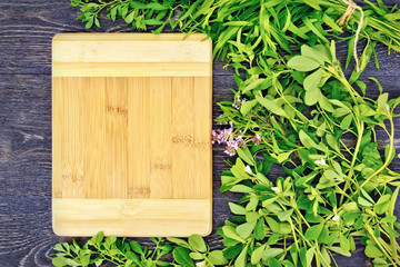 Frame of spicy grass and rectangular board