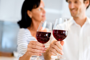 Portrait of a couple having a glass of red wine