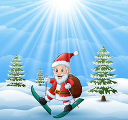 Fototapeta premium Santa claus skiing in the snow hill with sack of gifts