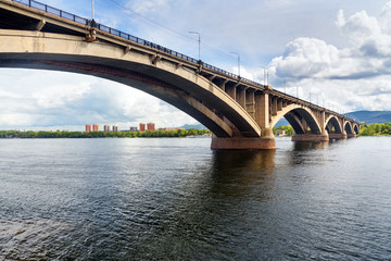 Fototapeta na wymiar Communal bridge across the Yenisei river. Krasnoyarsk, Russia