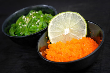Japanese food appetizer seaweed salad and tobiko
