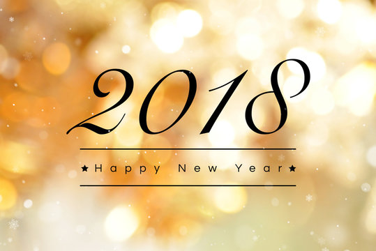 Happy New Year 2018 text on golden bokeh background
