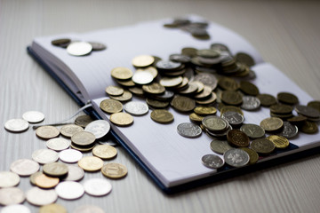 coins on the notebook on the table