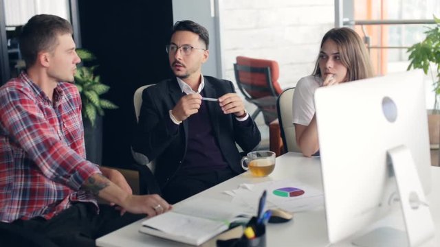 Group of young business people working together in creative office