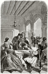 Ancient Greek rich family in traditional old clothes seated around a table in a elegant home interior. Created by Proust published on Le Tour du Monde Paris 1862