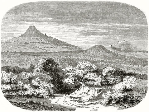 Ancient landscape, wood and vegetation on foreground, hills and mountain far on background. Mount Hohenstaufen in the Swabian Jura Germany. Created by Lancelot published on Le Tour du Monde Paris 1862