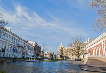 Fototapeta na wymiar Sunny day on a square in a European city.