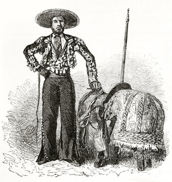 Old illustration of Mexican picador posing in his traditional costume close to his equipement. Created by Riou and Maurand after photo by unknown author published on Le Tour du Monde Paris 1862