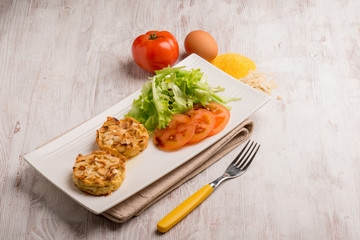 chicken medallions with sliced almond and salad