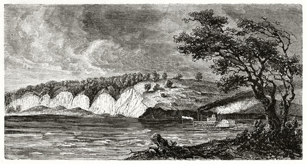 Ancient St Joseph surroundings along Missouri river USA. Steamboat sails the water under a dark stormy sky. By Guaiaud after The Geological Survey of Missouri published on Le Tour du Monde Paris 1862
