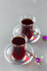 Red tea in turkish glasses on a wooden table