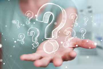 Businesswoman touching and holding hand drawn question marks