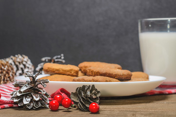 Biscuits, red berries, bumps, gifts, Christmas decor with free space for text. Top view