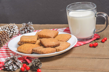 Biscuits, red berries, bumps, gifts, Christmas decor with free space for text. Top view