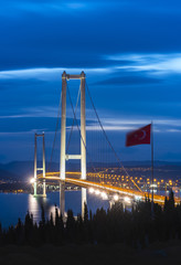 Fototapeta premium Osman Gazi Bridge (Izmit Bay Bridge). IZMIT, KOCAELI, TURKEY. Longest bridge in Turkey and the fourth-longest suspension bridge in the world by the length of its central span..