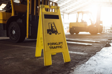 Sign showing warning of caution forklifts at industrial for safety.