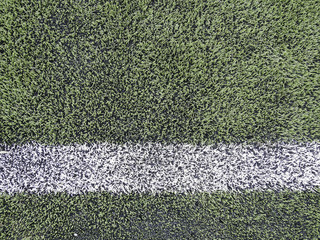 Close up on football field with artificial grass