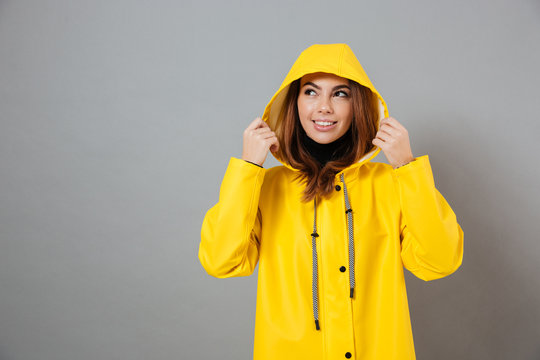 Portrait of a smiling girl dressed in raincoat