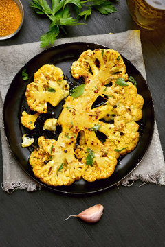 Fried cauliflower steak with herbs and spices