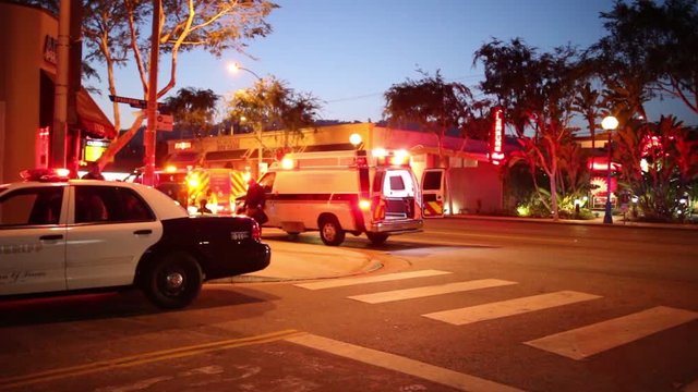 Cinemagraph - Flashing lights of ambulance car city street at night Motion Photo