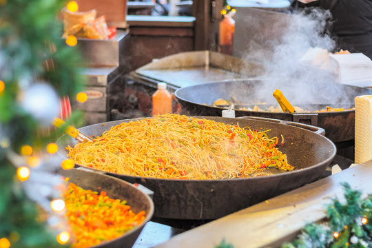 Chinese stir fried noodles on display at Christmas market in winter wonderland