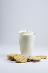 a glass with milk and biscuits