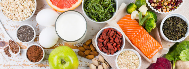 Selection of superfoods on rustic background