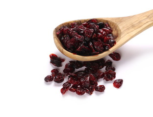 Dried cranberries in wooden spoon isolated on white background