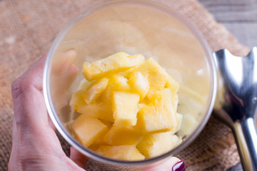 Pineapple slices in a blender