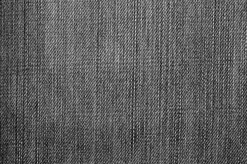 Texture of vintage blue jeans background, ripped jeans.