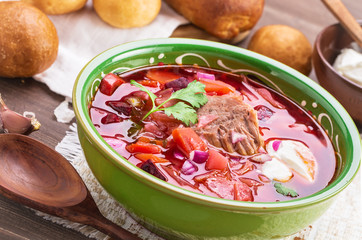 Russian borscht angled view closeup. Soup with beetroots, cabbage and beef.