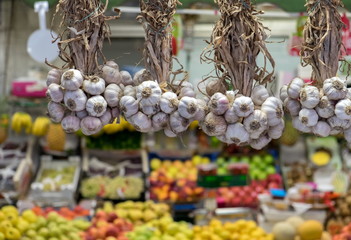 Hanging garlic for sale at Porto market (Mercado do Bolhao). Portugal