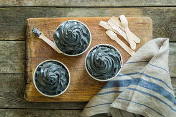 Black ice cream in white cups