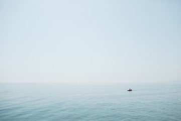 Lonely ship in a calm blue sea