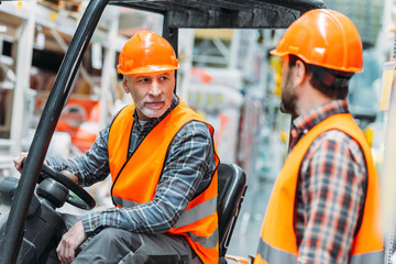 worker and his senior colleague working with forklift machine in shipping stock © LIGHTFIELD STUDIOS
