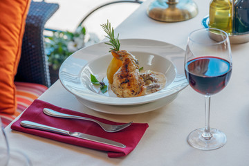 Summer lunch with red wine and a roasted duck leg