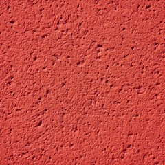 Fototapeta premium red colorful rough plaster detail, copy space for typing