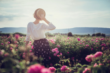 Flower series. Pink field. Crimea, the village of Turgenyevka. A country girl enjoys the sunset,...