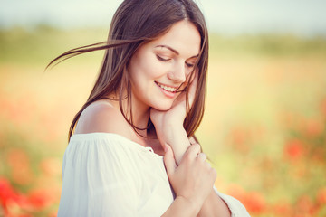 concept of freedom. Closeup portrait of an attractive woman at sunset