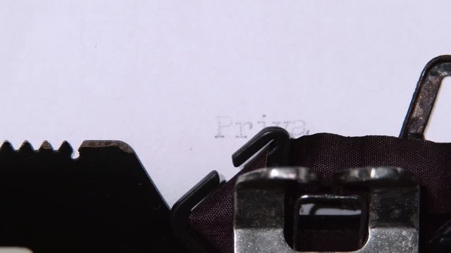 Security service prints a word on a typewriter privacy. Close up