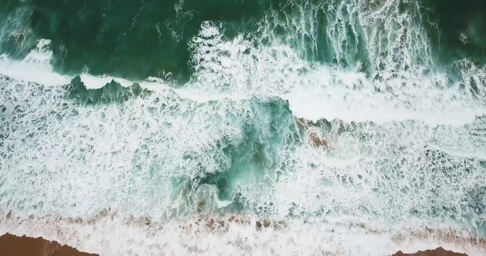 Australian beach viewed from above. Following the waves going towards the beach in Australia 