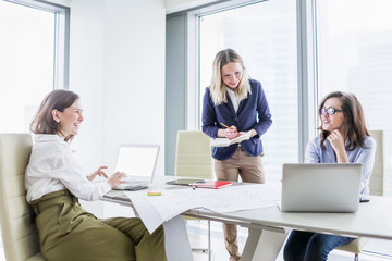 Group of happy business women having fun at work