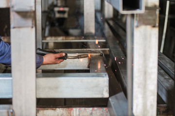 Close-up of welder's hands in working process