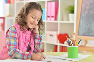  cute smiling girl drawing