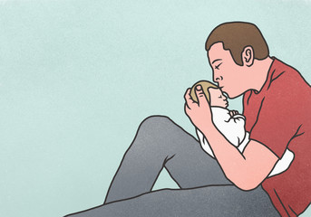 Side view of father kissing newborn baby against blue background